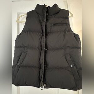 Cozy, stylish at black quilted vest. Perfect for layering.